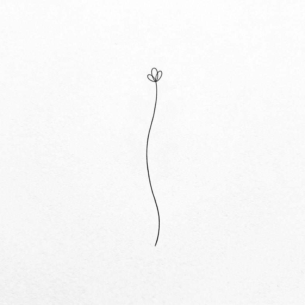 finger-tattoo fine floral sprig